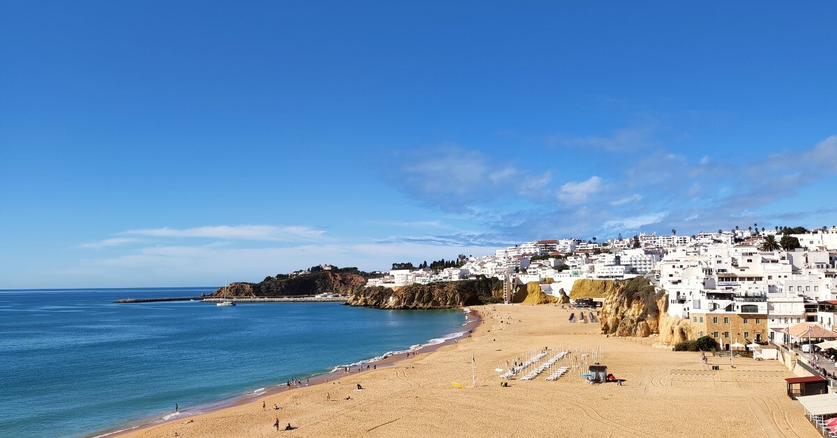 a photo of a beach on albufeira coastline, the best place to stay in algarve without a car