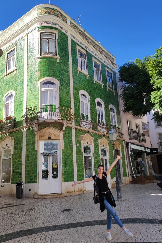 girl in front of a tiled building in lagos portugal