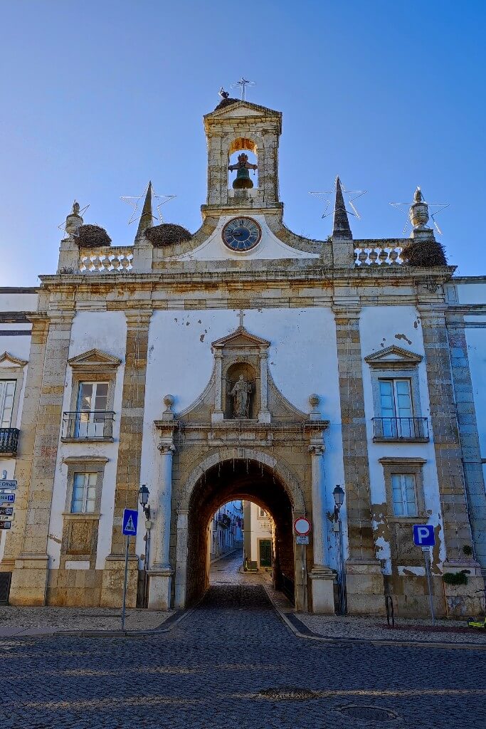 faro arco de vila historic entrance to the old town that looks like a church with bell on the top