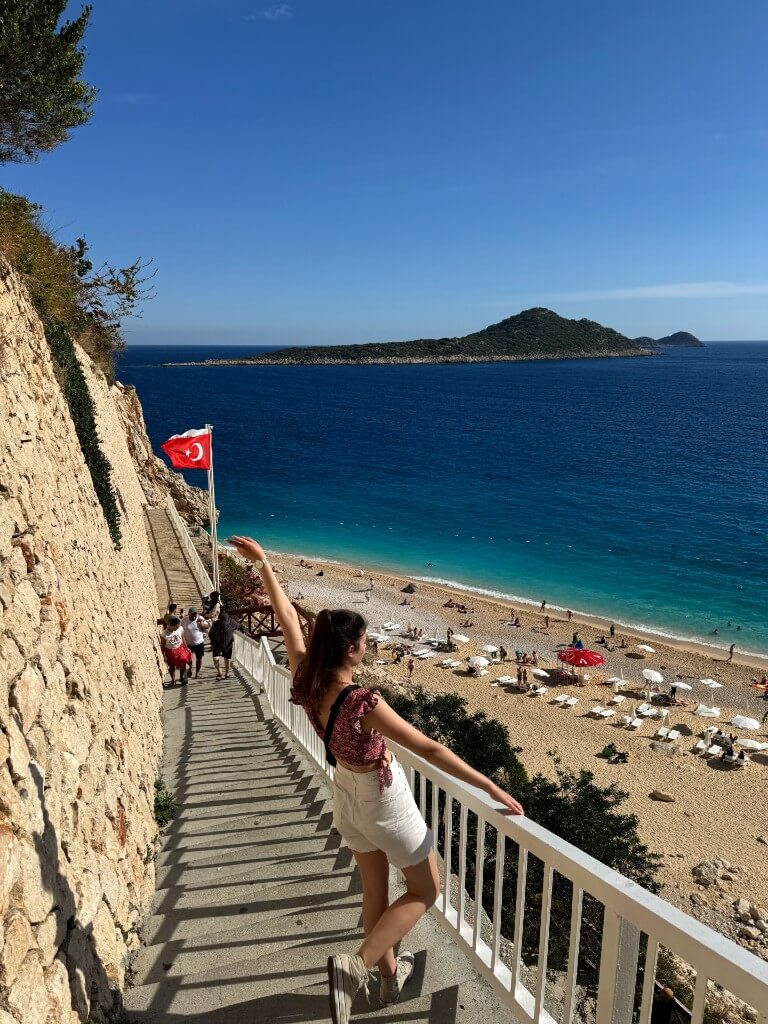 natali on the steps leading to kaputas beach in turkey