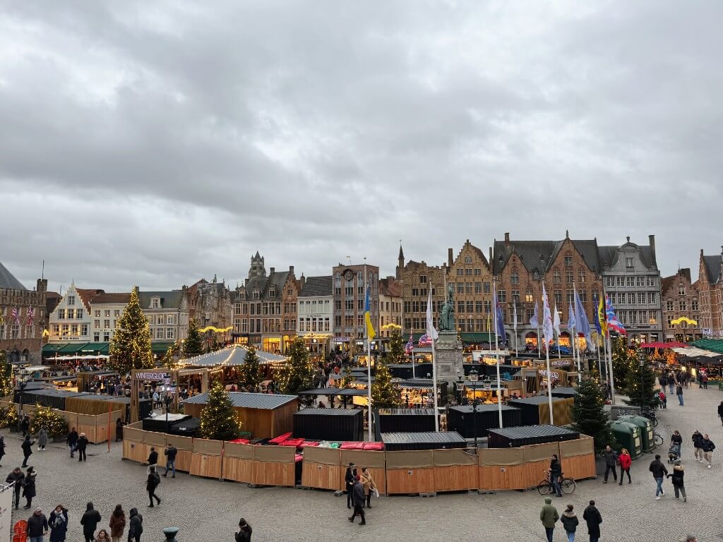 bruges christmas market n the main square Grote Markt surrounded by historic brick houses