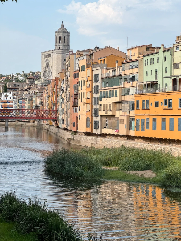 colorful houses lining the river in girona spain