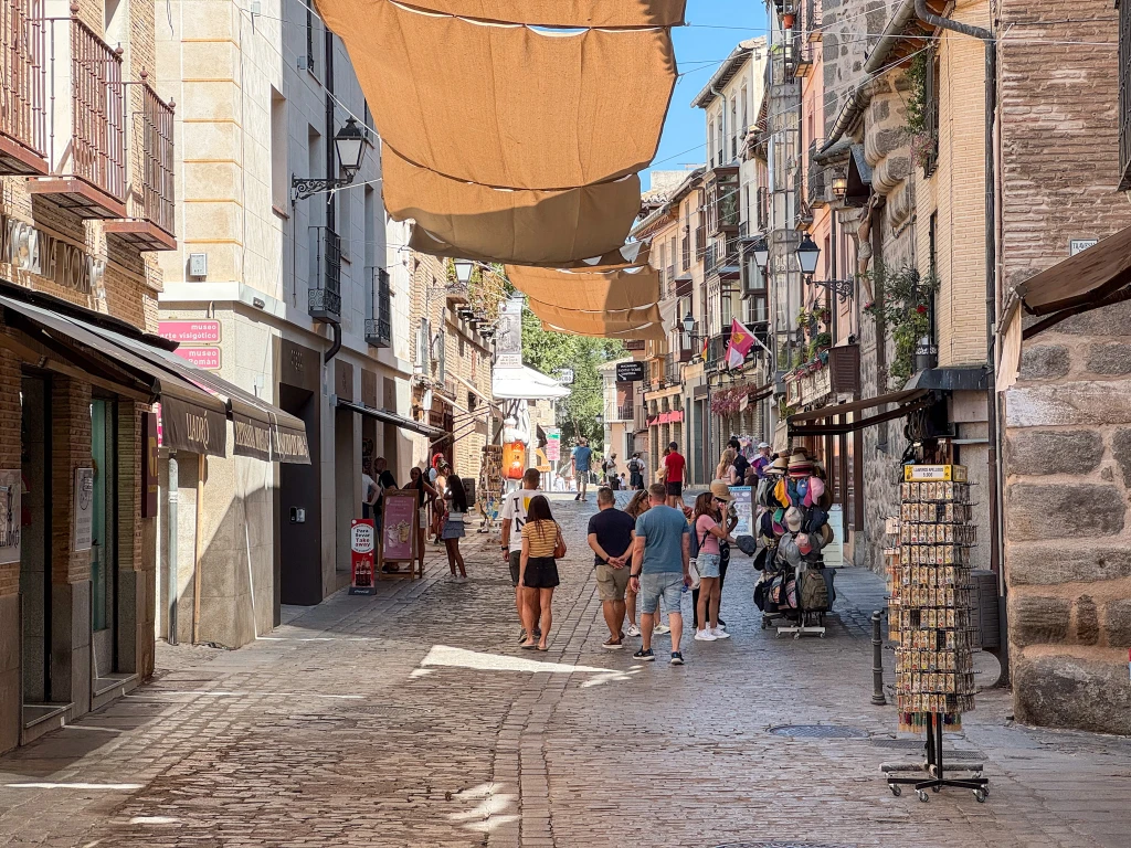 street shaded by large fabric above the walking street during summer in toledo
